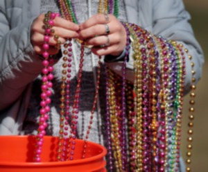 <strong>Lui Zeballos passed out Mardi Gras beads during a Mardi Growl dog party at Overton Park on March 7, 2020. This year&rsquo;s party is on Saturday, March 1.</strong> (Jim Weber/The Daily Memphian file)