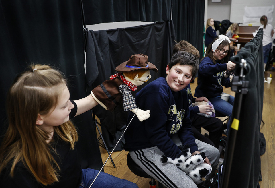 <strong>Fifth grader Clara Hanson (left) jokes with classmate Mack Phillips (right) during a puppetry club practice at Arlington Elementary School.</strong> (Mark Weber/The Daily Memphian)