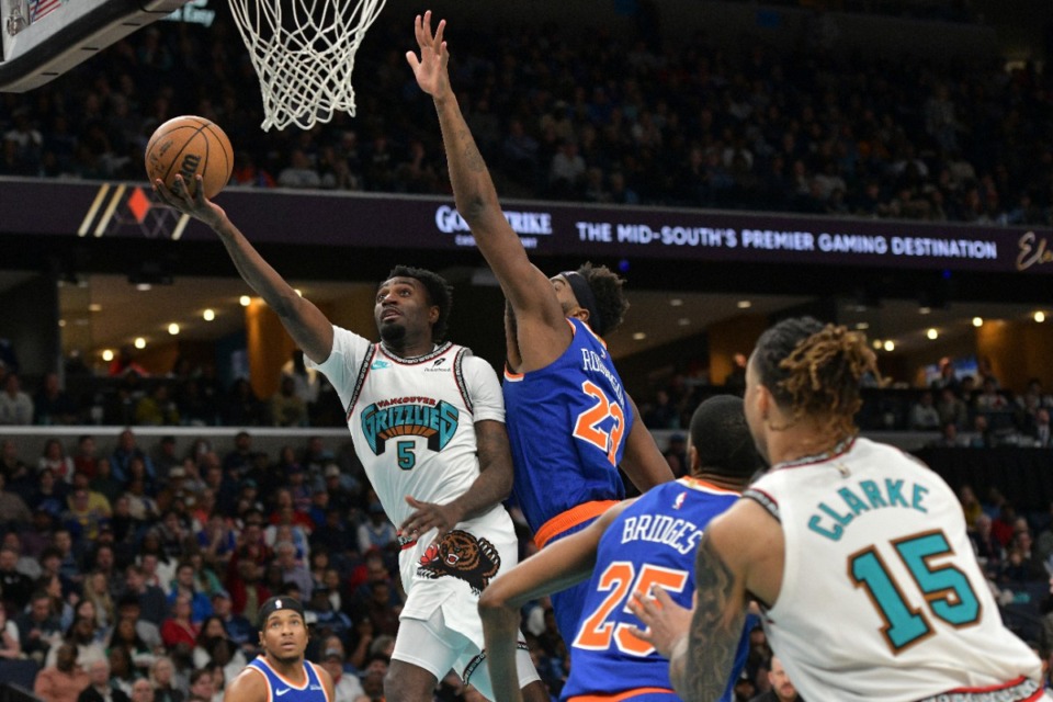 <strong>Memphis Grizzlies guard Vince Williams Jr. (5) shoots against New York Knicks center Mitchell Robinson (23) on Friday, Feb. 28, 2025.</strong> (Brandon Dill/AP)