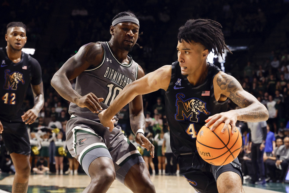 <strong>Memphis guard PJ Haggerty (4) drives to the basket around UAB guard Alejandro Vasquez during the first half of an NCAA college basketball game, Sunday, March 2, 2025, in Birmingham, Ala.</strong> (Butch Dill/AP Photo)