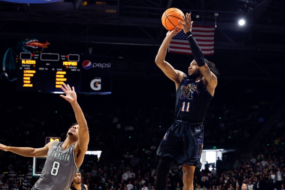 <strong>Memphis guard Tyrese Hunter (11) shoots a shot as UAB guard Efrem Johnson (8) defends during the first half of an NCAA college basketball game, Sunday, March 2, 2025, in Birmingham, Ala.</strong> (Butch Dill/AP)