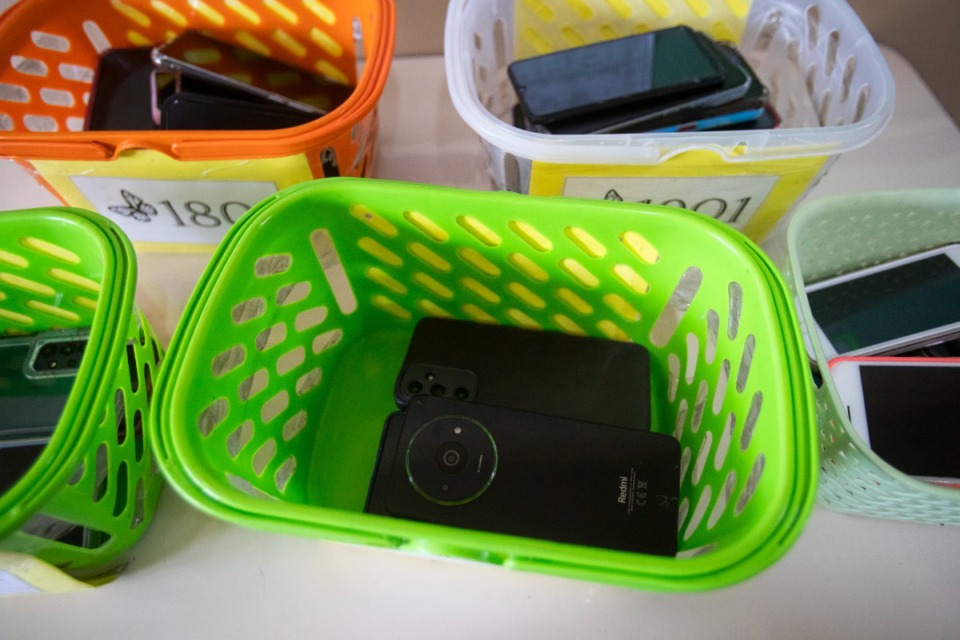 <strong>Students&rsquo; cellphones sit in baskets after they were turned in at the start of the school day in Rio de Janeiro, Wednesday, Feb. 5, 2025, on the first day of a national ban there that restricts the use of smartphones in elementary and high schools.</strong> (Bruna Prado/AP)