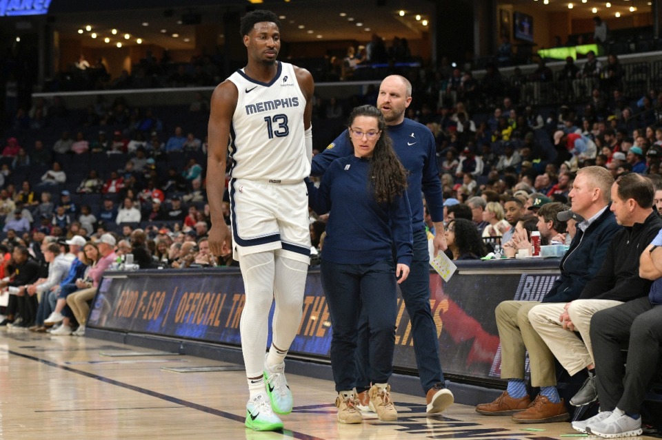 <strong>Memphis Grizzlies forward Jaren Jackson Jr. (13) is helped off the court in the first half of an NBA basketball game against the Atlanta Hawks, Monday, March 3, 2025, in Memphis, Tenn.</strong> (AP Photo/Brandon Dill)