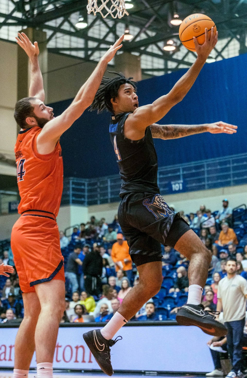 <strong>Memphis guard PJ Haggerty (4) drives to the basket past UTSA&rsquo;s David Hermes (14) in San Antonio Tuesday, March 4, 2025. Haggerty finished with 18 points.</strong> (AP Photo/Rodolfo Gonzalez)