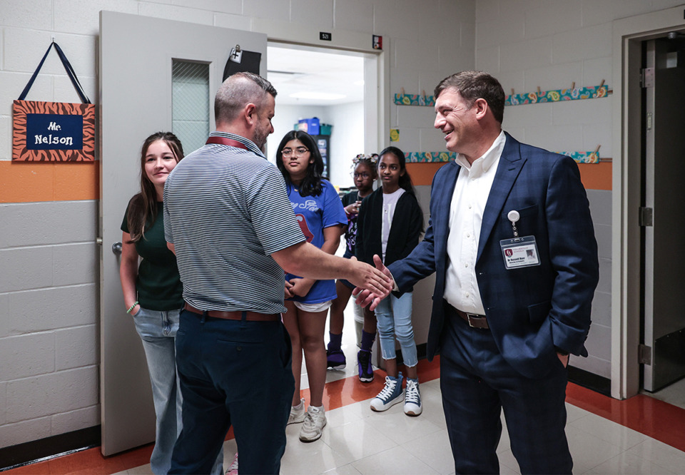 <strong>Collierville Schools Superintendent Russell Dyer shakes hands with teachers on the first day of school at Sycamore Elementary on Aug. 8, 2024.</strong> (Patrick Lantrip/The Daily Memphian file)