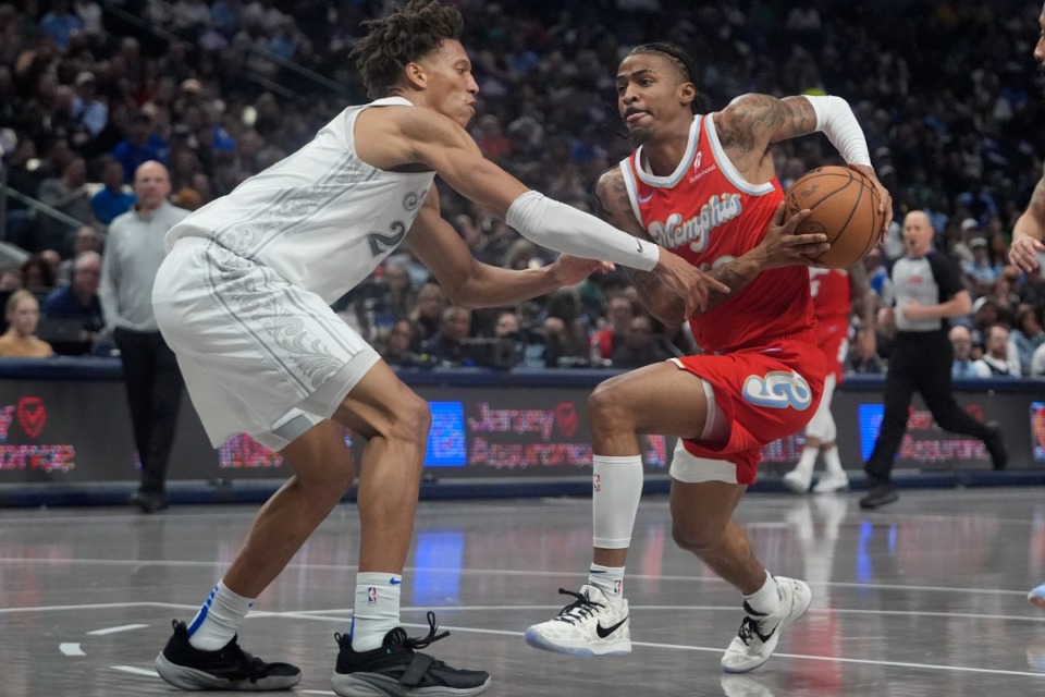 <strong>Memphis Grizzlies guard Ja Morant, right, who scored 31 points, drives against Dallas Mavericks forward Kessler Edwards, left, in Dallas, Friday, March 7, 2025.</strong> (LM Otero/AP)