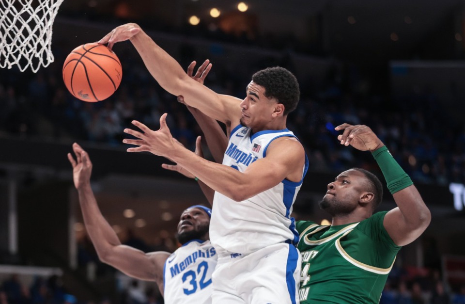 <strong>University of Memphis forward Nicholas Jourdain (2) grabs a rebound during the March 7, 2025, game against South Florida.</strong> (Patrick Lantrip/The Daily Memphian)