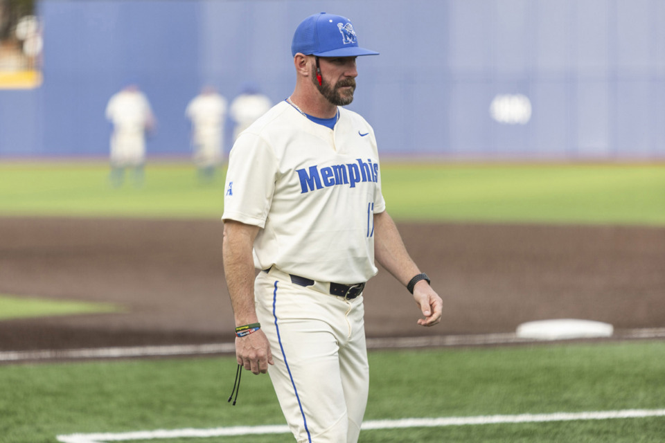 <strong>Memphis Tigers baseball head coach Matt Riser walks during a Feb. 21, 2024, game versus Central Arkansas at FedExPark Avron Fogelman Field wearing his signature wristbands.</strong> (Brad Vest/Special to The Daily Memphian)