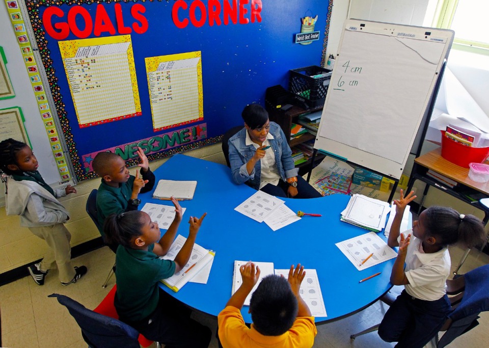 <strong>Teacher Jessica Alexander works with second graders at Frayser Elementary School in 2013. The school was then part of the state-run Achievement School District (ASD), an intervention for low-performing schools that lawmakers may scrap in favor of a new model.</strong>&nbsp;(The Daily Memphian file)