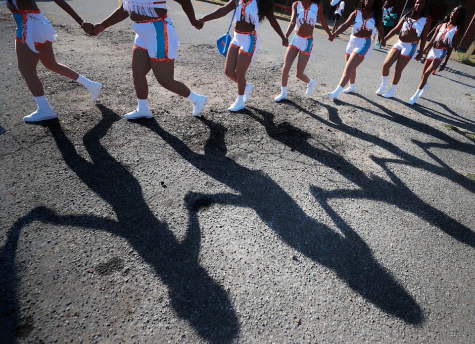 <strong>Members of the Dynamic Angels dance team wind their way through the crowd to their starting position before the Southern Heritage Classic Parade on Park Avenue in Orange Mound on Sept. 14, 2019. The annual parade, presented by the Orange Mound Community Parade Committee (OMCPC), marks the 30th anniversary of the SHC football game with marching bands, majorettes, fancy cars and lots of tossed candy.</strong> (Jim Weber/Daily Memphian)