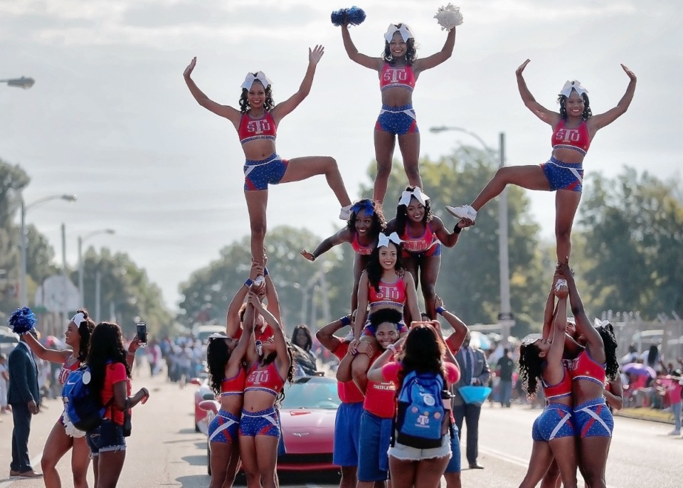 <strong>Tennessee State University Tigers cheerleaders perform during the Southern Heritage Classic Parade on Park Avenue in Orange Mound on Sept. 14, 2019. The annual parade, presented by the Orange Mound Community Parade Committee (OMCPC), marks the 30th anniversary of the SHC football game with marching bands, majorettes, fancy cars and lots of tossed candy.</strong> (Jim Weber/Daily Memphian)