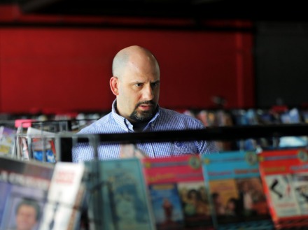 <strong>Bryan Artiles peruses the massive collection of obscure, essential and sometimes strange DVDs at Black Lodge.</strong>&nbsp;(Patrick Lantrip/Daily Memphian)