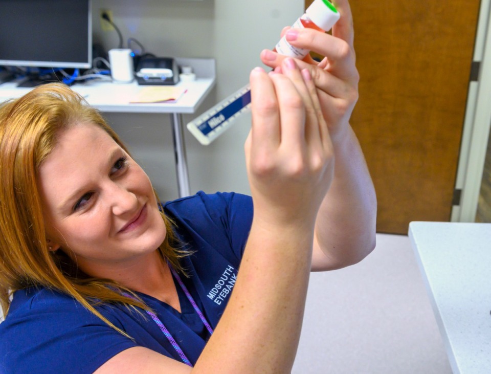 <strong>Lyndsey Chastain, technical coordinator at the Mid South Eye Bank in Bartlett, measures corneal tissue harvested on Sept. 13, 2019.</strong> (Greg Campbell/Special to The Daily Memphian)