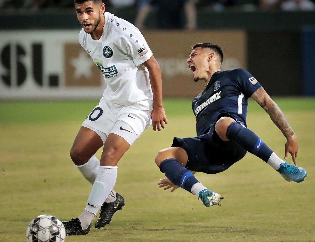 <strong>Memphis midfielder Pierre Da Silva (right) draws a penalty against the St. Louis FC squad's Collin Fernandez during 901FC's 1-0 win over St. Louis at AutoZone Park on Sept. 21, 2019.</strong> (Jim Weber/Daily Memphian)