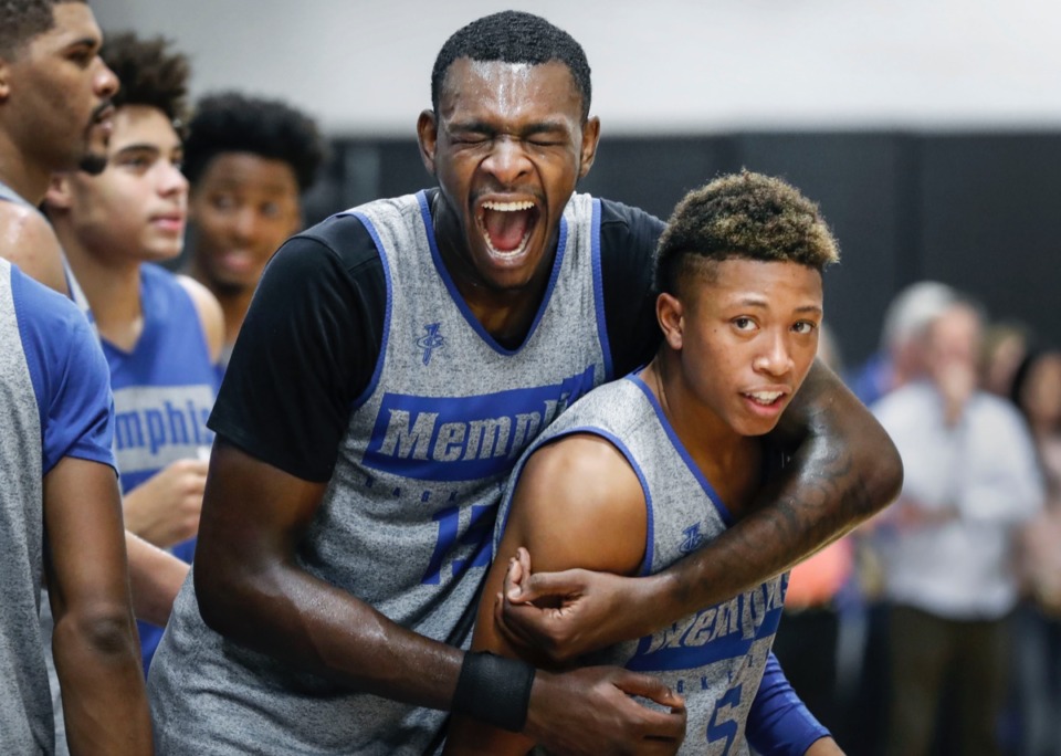 <strong>University of Memphis teammates Lance Thomas (left) and Boogie Ellis (right) horse around during an open practice in front of the Rebounders Club Sept. 24.</strong> (Mark Weber/Daily Memphian)