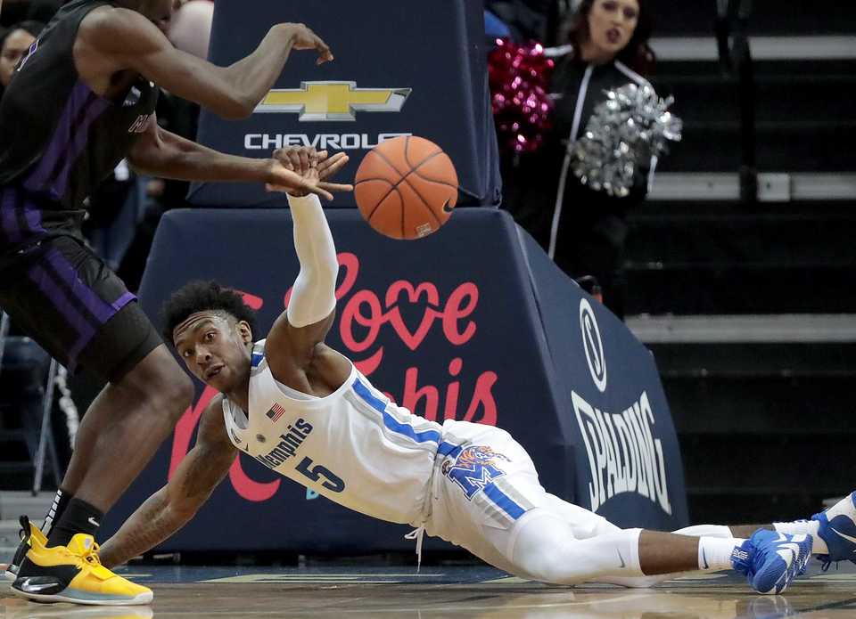 <strong>University of Memphis guard Kareem Brewton Jr. (5) tries to get control of a loose ball during the Tigers' game against LeMoyne-Owen at FedExForum&nbsp;in Memphis on Oct. 25, 2018.</strong> (Jim Weber/Daily Memphian)