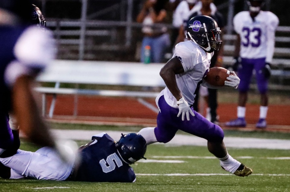 <strong>Southwind running back Romal Webb (right) runs by Kirby defender Tamarious Brown (left) during action in their high school football game Friday, Sept. 20.</strong> (Mark Weber/Daily Memphian)