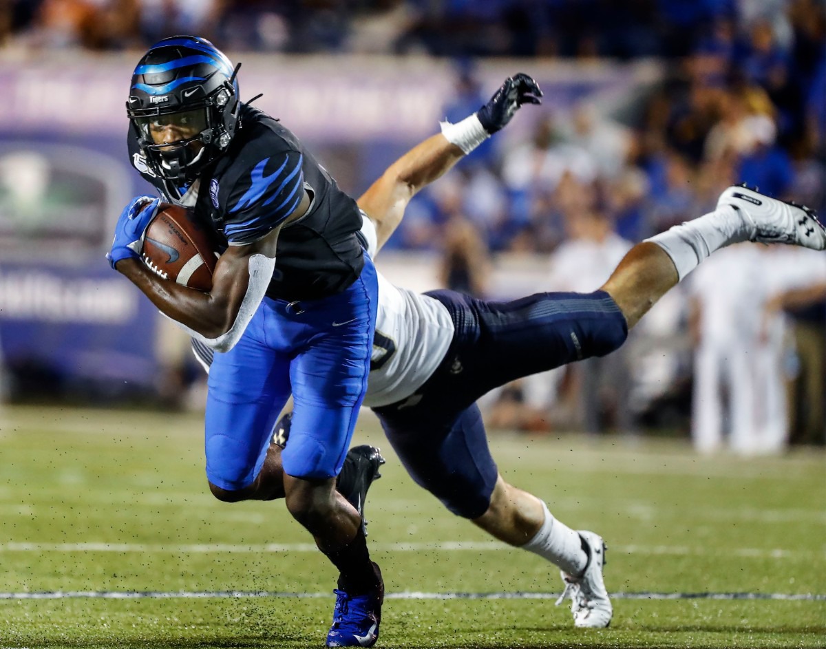 <strong>Memphis receiver Damonte Coxie (left) grabs a touchdown catch in front of Navy defender Kevin Brennan (right) in the U of M's 35-23 victory at Liberty Bowl Memorial Stadium Sept. 26.</strong> (Mark Weber/Daily Memphian)