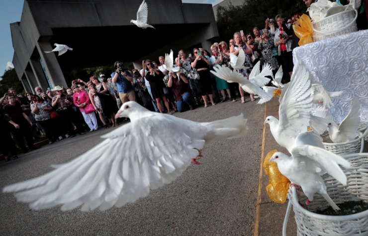 <strong>Doves are released after a memorial service Sunday at Christ United Methodist. The service honored some 900 donors who participated in the Genesis program over the last year.</strong> (Jim Weber/Daily Memphian)