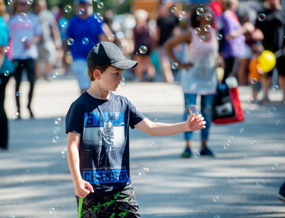 <strong>Jordan Marks-Gow pauses to catch a few bubbles at the Bartlett Festival Saturday, Sept. 28, at W.J. Freeman Park in Bartlett.</strong> (Greg Campbell/Special to the Daily Memphian)