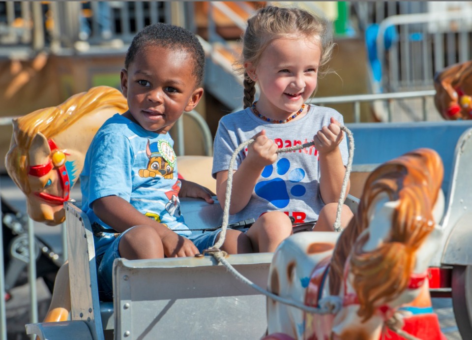 <strong>Emanual Bean, 2, and his driver, Izzy Dunn, 4, ride a horse and buggy ride at the Bartlett Festival Saturday, Sept. 28, at W.J. Freeman Park.</strong> (Greg Campbell/Special to the Daily Memphian)