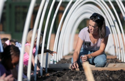 <strong>Mary Riddle shows the kids of Lynn Erickson's pre-K class at Hutchison School how to plant carrots in the school's recently expanded garden Sept. 25, 2019.</strong> (Patrick Lantrip/Daily Memphian)
