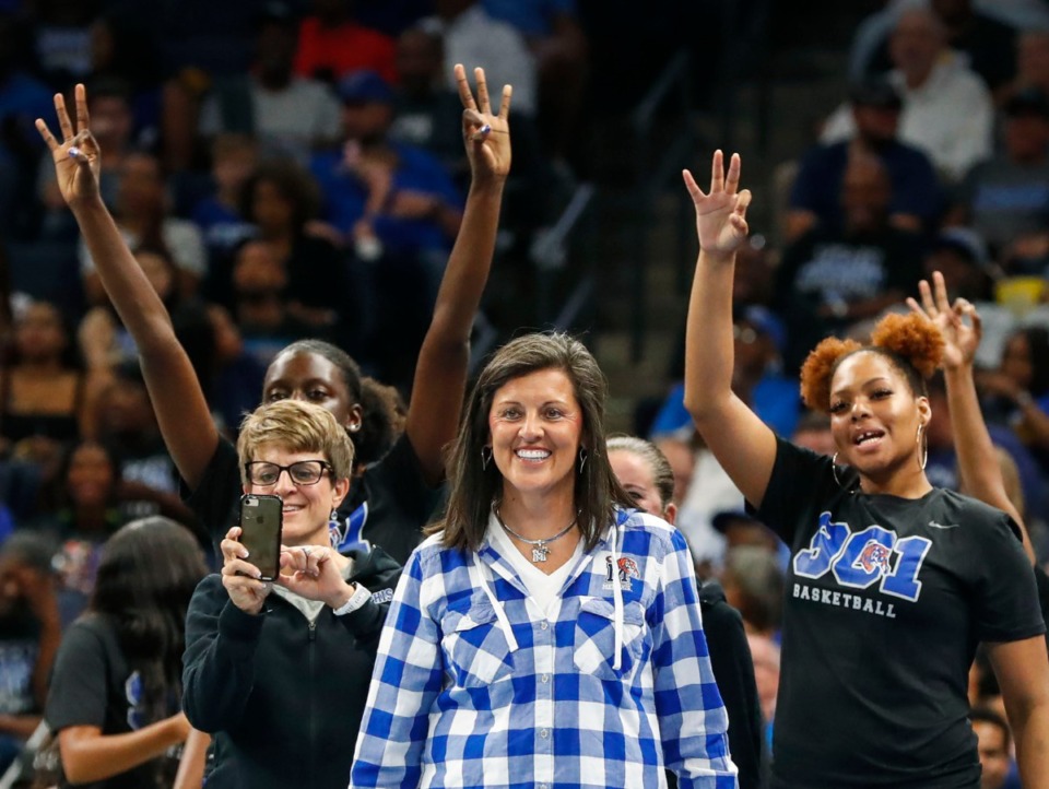 <strong>Memphis Tigers women's basketball head coach Melissa McFerrin (middle) celebrates with her team during Memphis Madness at the FedExForum Thursday, Oct. 3, 2019.</strong> (Mark Weber/Daily Memphian)