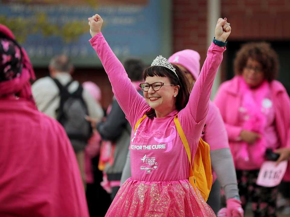 <strong>Tish Pinion, who has been a breast cancer survivor for a year, lets out a cheer before the start of the Susan G. Komen Race for the Cure on Oct. 27, 2018. Downtown was flooded with pink tutus, pink wigs and pink feathered boas Saturday morning as over 6,000 runners turned out for the annual race to raise money to fund research, education, screening and treatment of breast cancer.</strong> (Jim Weber/Daily Memphian)