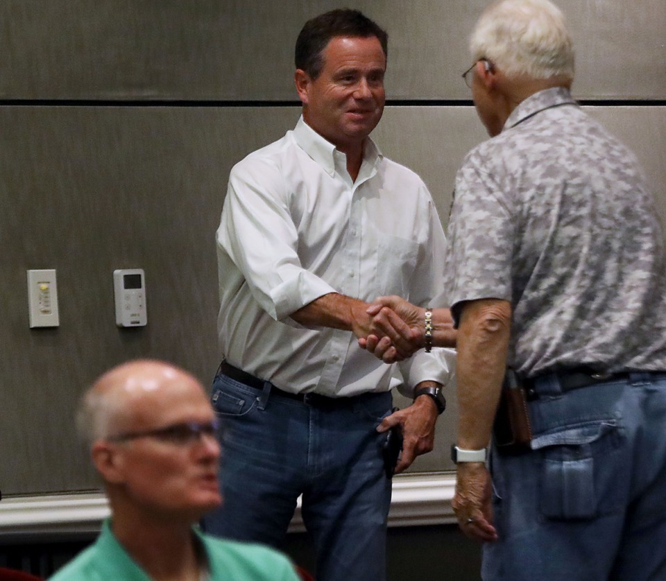 <strong>John Porter shakes hands with Alderman Tom Allen as he leaves a Sept. 5 Collierville Planning Commission meeting where his residential proposal was rejected.&nbsp;The developer&nbsp;is asking the Board of Mayor and Aldermen to review zoning of the land for his proposed Quinn Ridge development.</strong>&nbsp; (Patrick Lantrip/Daily Memphian)