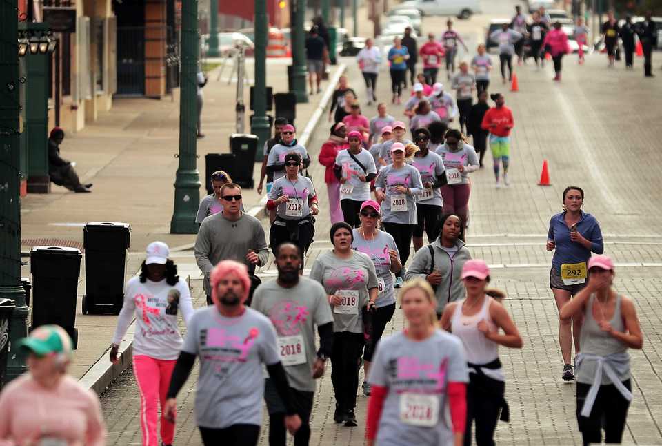 <strong>Runners turn onto Beale Street Saturday morning as over 6,000 runners participated the annual Susan G. Komen Race for the Cure to raise money to fund research, education, screening and treatment of breast cancer.</strong> (Jim Weber/Daily Memphian)