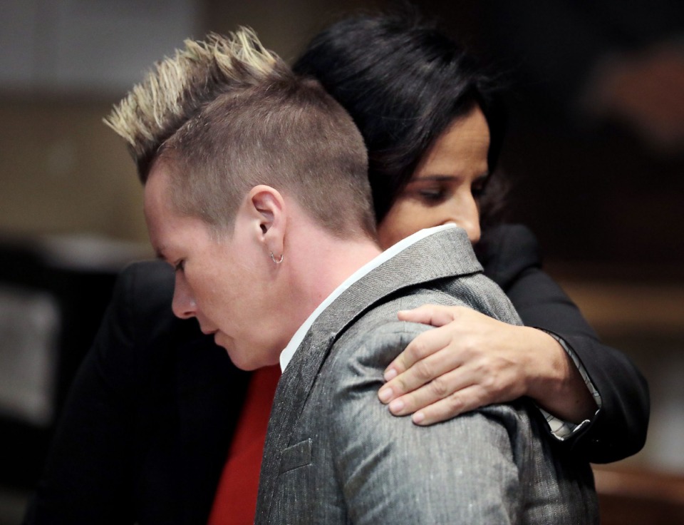 <strong>April Alley (front), the daughter of Sedley Alley, hugs a member of her legal counsel in&nbsp;Shelby County Criminal Court Monday,&nbsp;Oct. 14. Alley is seeking to have&nbsp;DNA tested to prove the innocence of her father, who was executed in 2006 in the rape and murder of Suzanne Collins, a 19-year-old Marine stationed at the Millington Naval Air Station.</strong> (Patrick Lantrip/Daily Memphian)