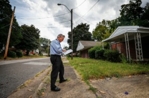<strong>Steve Shular, City of Memphis special assistant for neighborhood concerns, surveyed vacant homes and blighted areas last week on Red Oak Street in Binghampton.</strong> (Mark Weber/Daily Memphian)