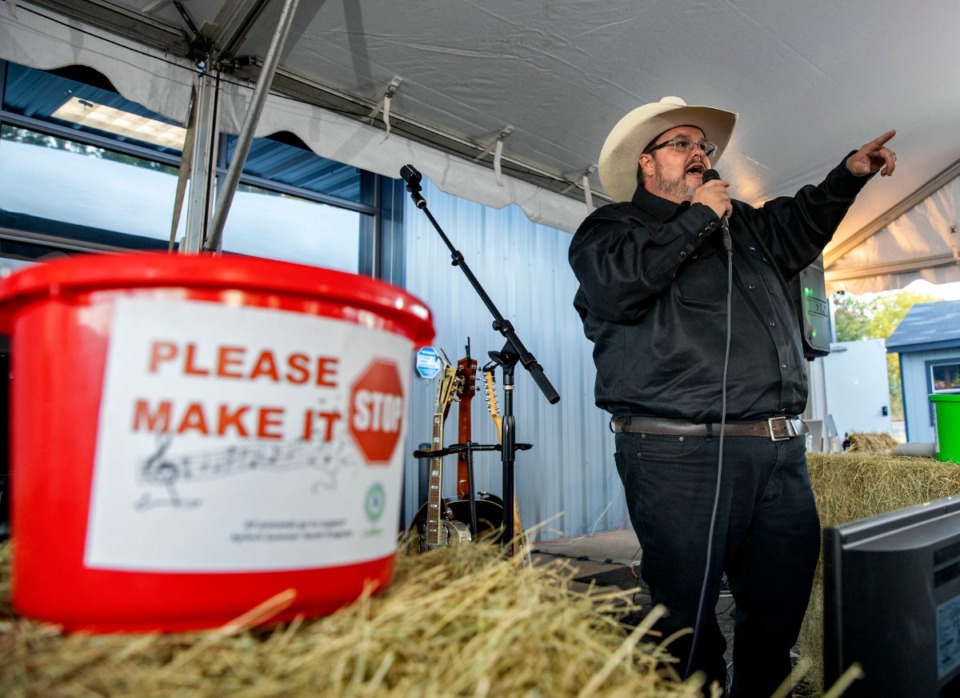 <strong>Bob Wilson, owner and CEO of H Saga/Port Alliance in Arlington, explains that donations can encourage good singing but also can help make less-good singing stop as he introduces performers at Cookout and Karaoke for a Cause on Oct. 18, 2019.</strong> (Mike Kerr/Special to Daily Memphian)