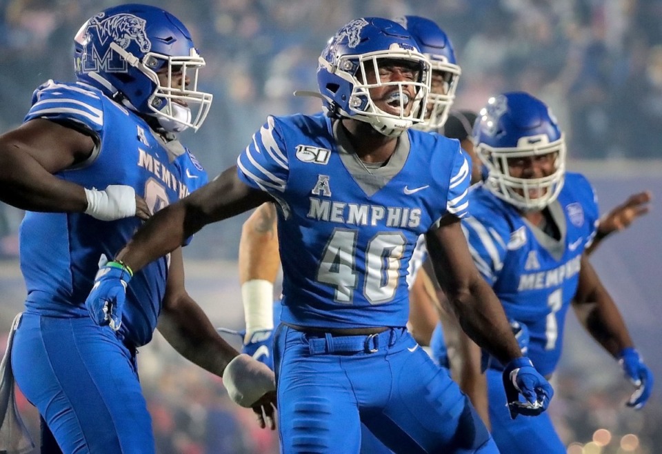 <strong>University of Memphis linebacker Thomas Pickens (40) celebrates after intercepting a Tulane pass during the Tigers game on Oct. 19, 2019, against the Green Wave at Liberty Bowl Memorial Stadium in Memphis.</strong> (Jim Weber/Daily Memphian)