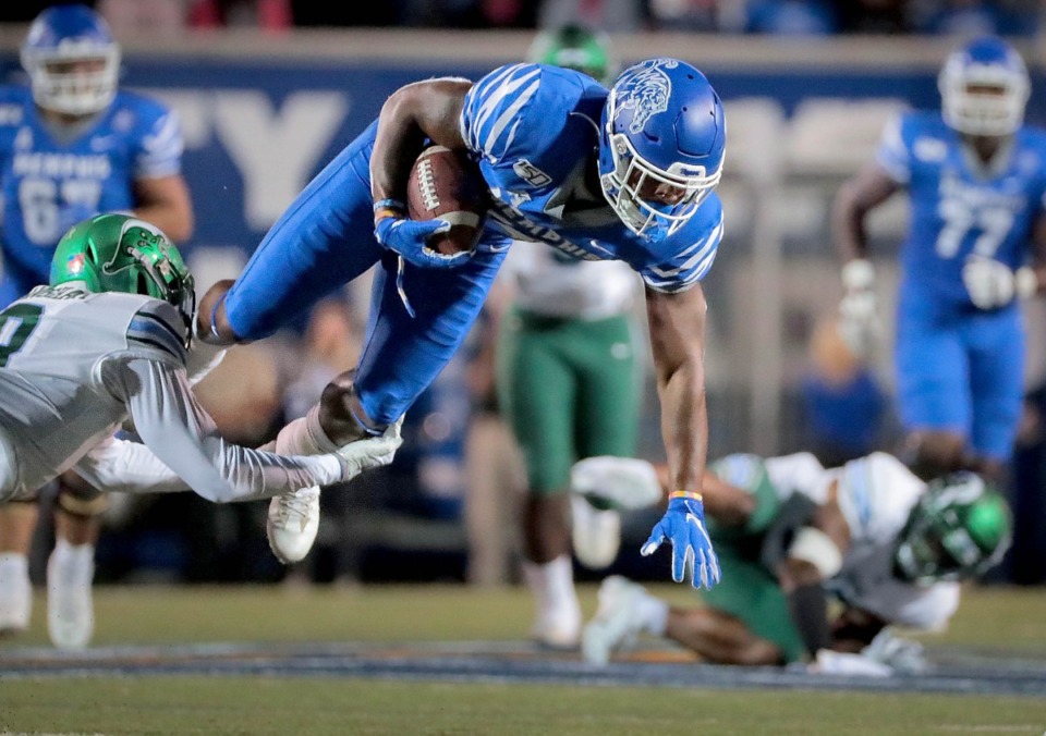 <strong>University of Memphis receiver Antonio Gibson is taken down by Tulane's Willie Langham during the Tiger's game on Oct. 19, 2019 against the Green Wave at Liberty Bowl Memorial Stadium in Memphis.</strong> (Jim Weber/Daily Memphian)