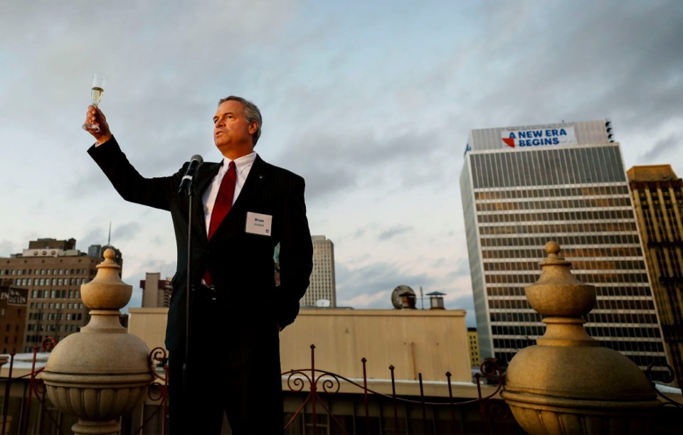 <strong>First Horizon National Corporation CEO Bryan Jordan offers a toast before unveiling the company's new logo and building signage on the rooftop of the historic Peabody Hotel in Downtown Memphis Oct. 21.</strong> (Mark Weber/Daily Memphian)