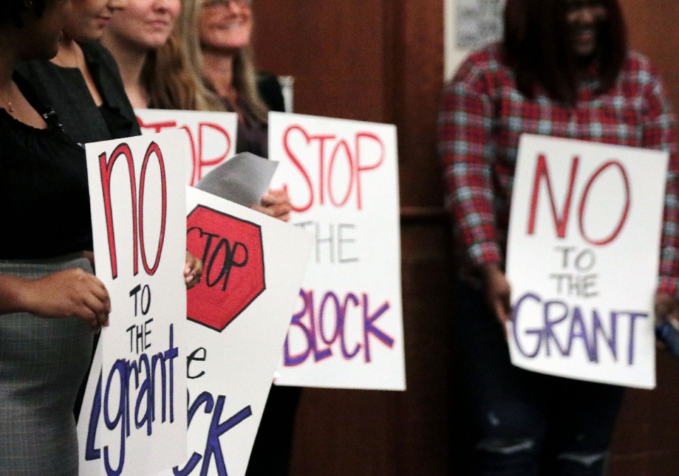 <strong>Signs held by University of Memphis students opposing Tennessee's TennCare Block Grant proposal reflected the near-unanimous and often passionate disapproval for the attendees of a town hall meeting at the University of Memphis Oct. 15, 2019.</strong> (Patrick Lantrip/Daily Memphian)