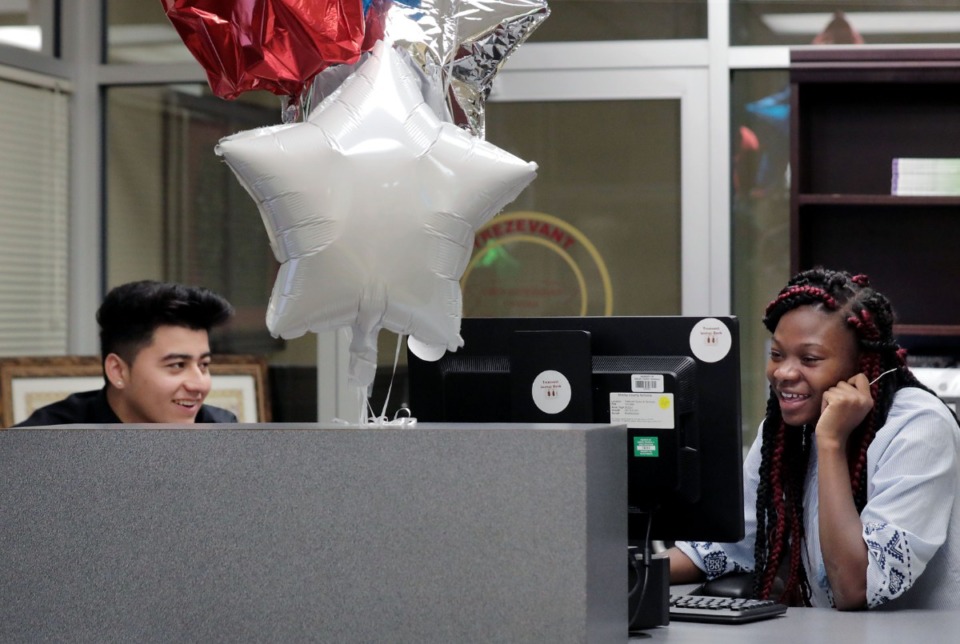 <strong>Cristian Alvarado (left) and Arizee Tucker work at the student-run Trezevant Savings Bank at the Trezevant Career and Technology Center in Frayser Thursday, Oct. 24.</strong>&nbsp;<strong>Alvarado is an auditor and Tucker is a sales clerk at the bank.&nbsp;<span>&ldquo;</span><span>The responsibility we have here is going to help us to be more responsible in the future,&rdquo; says Alvarado.</span></strong>&nbsp;(Patrick Lantrip/Daily Memphian)