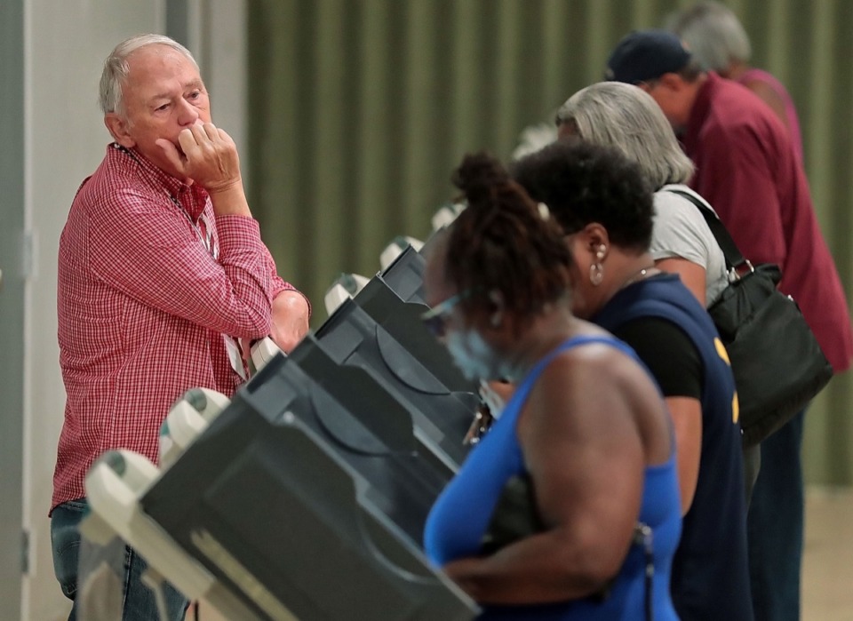 <strong>Poll worker Thomas Rogers watches over a steady stream of voters at Abundant Grace Fellowship Church on Sept. 28.</strong> (Jim Weber/Daily Memphian)