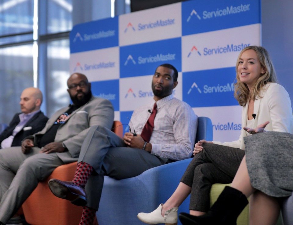 <strong>Cara Greenstein (right) answers a question during a panel discussion organized as part of a symposium put on by a ServiceMaster internal work group Thursday, Oct. 24. Panelists at the event at the Downtown Memphis ServiceMaster headquarters included (from left)&nbsp; Preston Butts, Phillip Ashley Rix and David French.</strong> (Patrick Lantrip/Daily Memphian)
