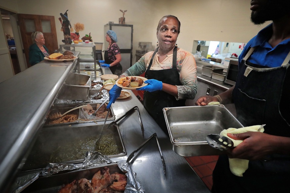 <strong>Debra Williams, 60, cooks and serves the lunch meal for seniors at the Lucille McWherter Senior Center Oct. 25, as she has done for the last 30 years.</strong> (Jim Weber/Daily Memphian)