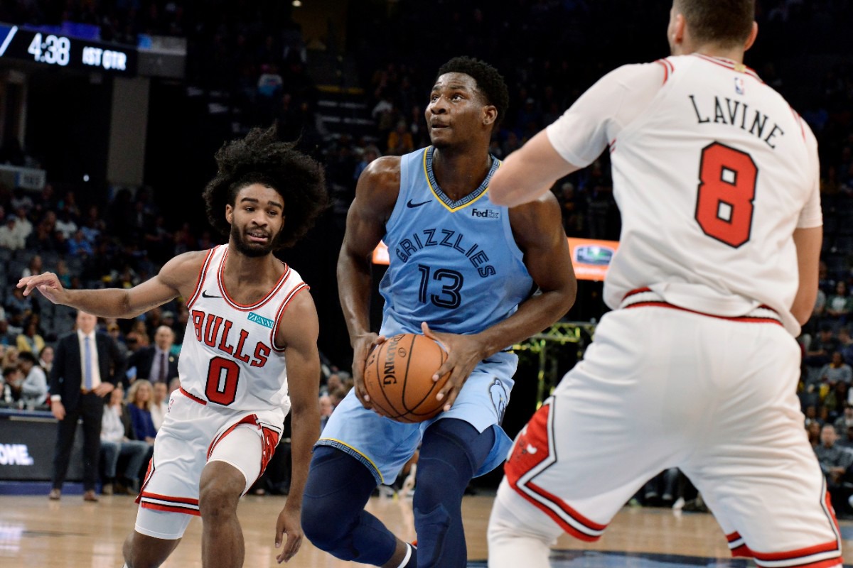 <strong>Grizzlies forward Jaren Jackson Jr. (13) looks to shoot between Chicago Bulls guards Coby White (0) and Zach LaVine (8) Oct. 25.</strong> (Brandon Dill/AP)