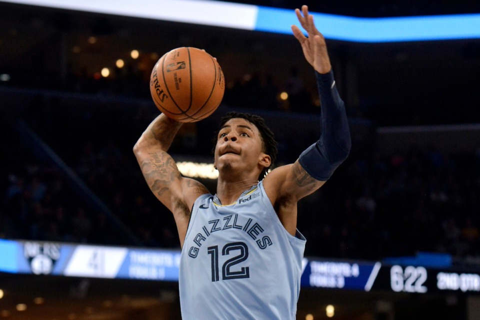 <strong>Memphis Grizzlies guard Ja Morant (12) goes up for a dunk Oct. 27.</strong> (Brandon Dill/AP)