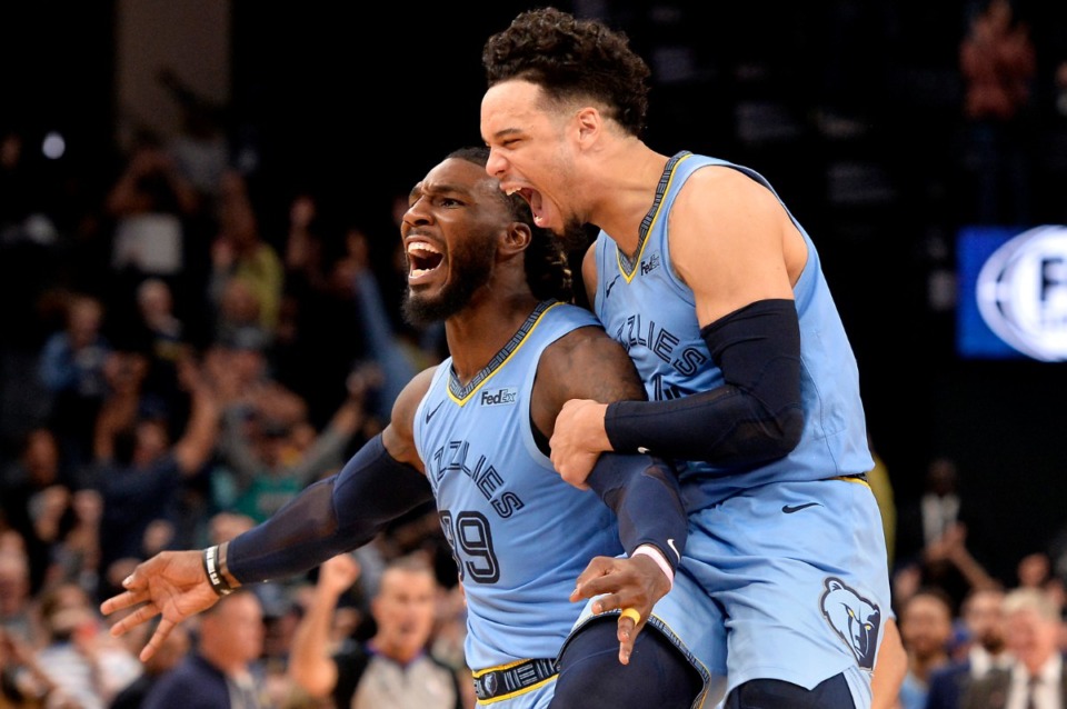 <strong>Grizzlies forward Jae Crowder (99) and guard Dillon Brooks react after Crowder scored a winning three-point basket as time expired during overtime of an NBA basketball game against the Brooklyn Nets Oct. 27 at FedExForum.</strong> (Brandon Dill/AP)