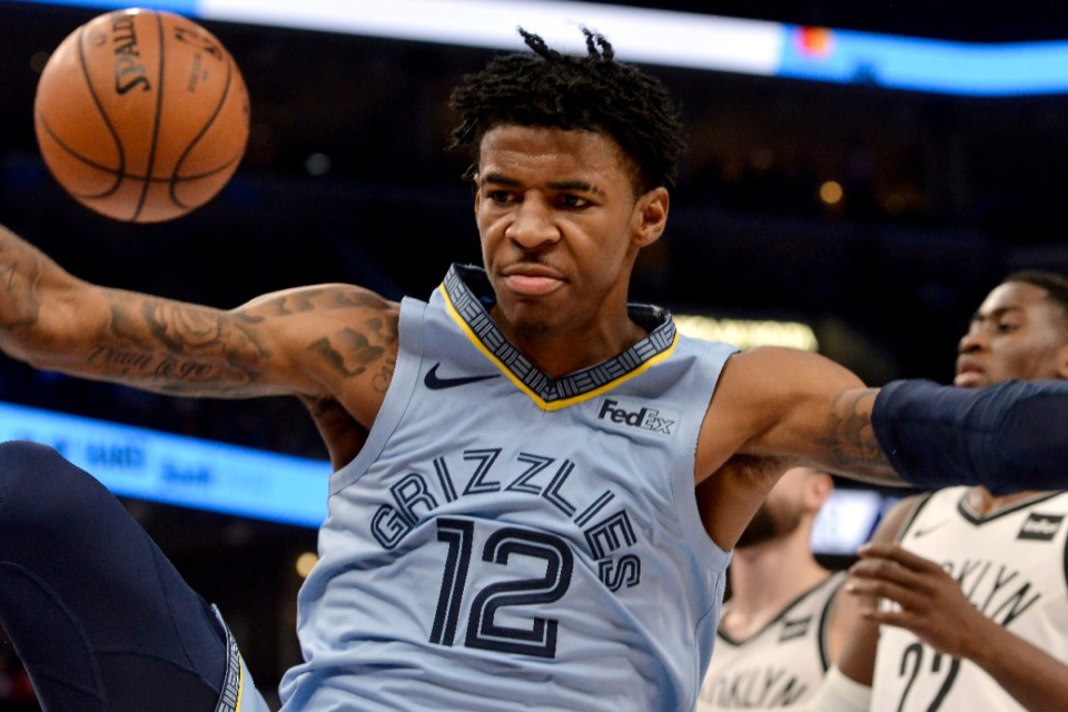 <strong>Grizzlies guard Ja Morant (12) dunks on the Brooklyn Nets Oct. 27.</strong> (Brandon Dill/AP)