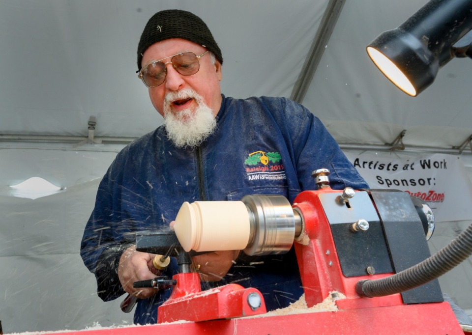 <strong>Rick Cannon from Memphis works on hand turned tops as part of the artists demonstrations at the River Arts Festival on Riverside Drive Saturday, October 26, 2019.</strong> (Greg Campbell/Special for The Daily Memphian)