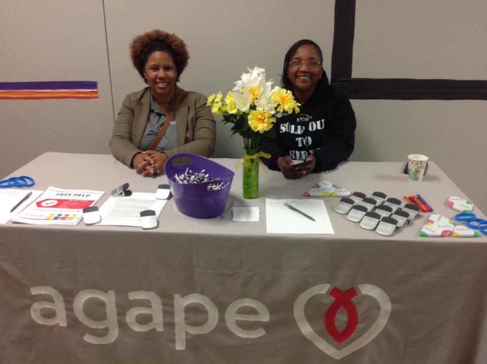 <strong>Agape Hickory Hill Family Connectors Tonya Rockiemore and Cora Jones greet visitors to the organization's Hickory Hill career and community fair Oct. 19.</strong>&nbsp;(Courtesy Agape)