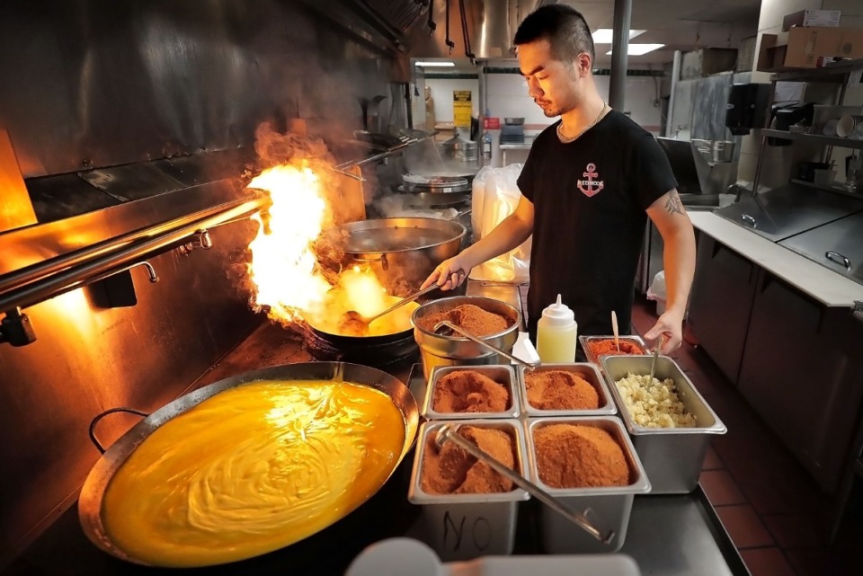 <strong>During a visit to Red Hook Cajun Seafood &amp; Bar in Bartlett in July, Liu Zengfeng prepared sauces to spice up the boiled seafood. The newest location is at 3295 Poplar.&nbsp;</strong>(Jim Weber/Daily Memphian)