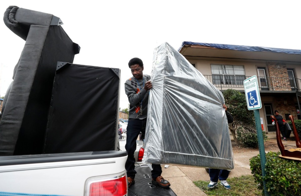 <strong>Kendall Rose helps his son load furniture from his condemned home at Cottonwood Apartments Tuesday, Oct. 29. Displaced residents and victims in the Parkway Village area affected by the strong winds and heavy rains last week are reaching out to the American Red Cross and other agencies for assistance.</strong> (Mark Weber/Daily Memphian)