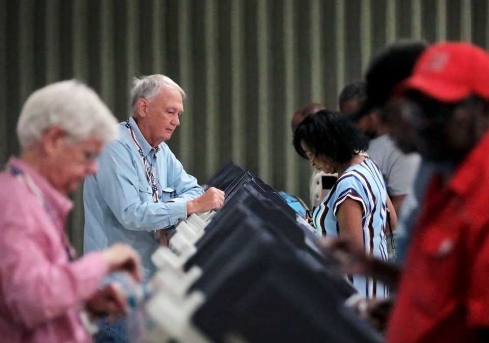 <strong>Thomas Rodgers (left) assists a throng of early voters at Whitehaven's Abundant Grace Fellowship Church on Sept. 20, 2019.</strong> <strong>Early voting in the runoff elections for council districts 1 and 7 opened on Oct. 25.</strong> (Patrick Lantrip/Daily Memphian)